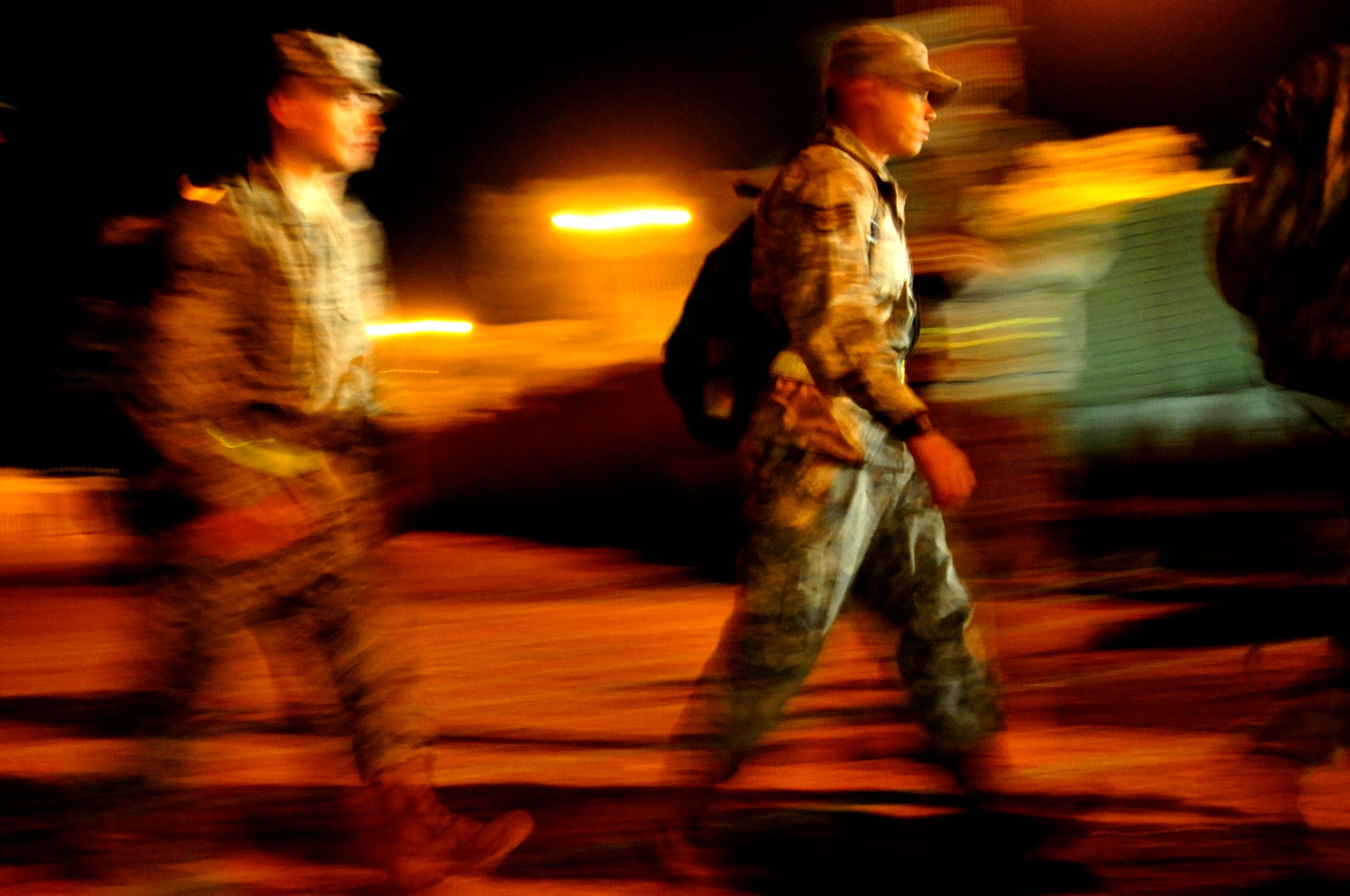 U.S. service members gather early in the morning on Nov. 1, 2011, near their tents in Iraq to begin their journey to the U.S.  The group was deployed in support of Operation New Dawn and helped create a more stable, sovereign and self-reliant Iraq. The U.S. military is on track to honor its commitment to the U.S.-Iraq Security Agreement and redeploy the remaining 33,000 troops by Dec. 31, 2011. At the height of the surge in 2007, there were 165,000 U.S. troops in Iraq. This drawdown is one of the largest military operations since World War II.  (U.S. Air Force photo/Master Sgt. Cecilio Ricardo)
