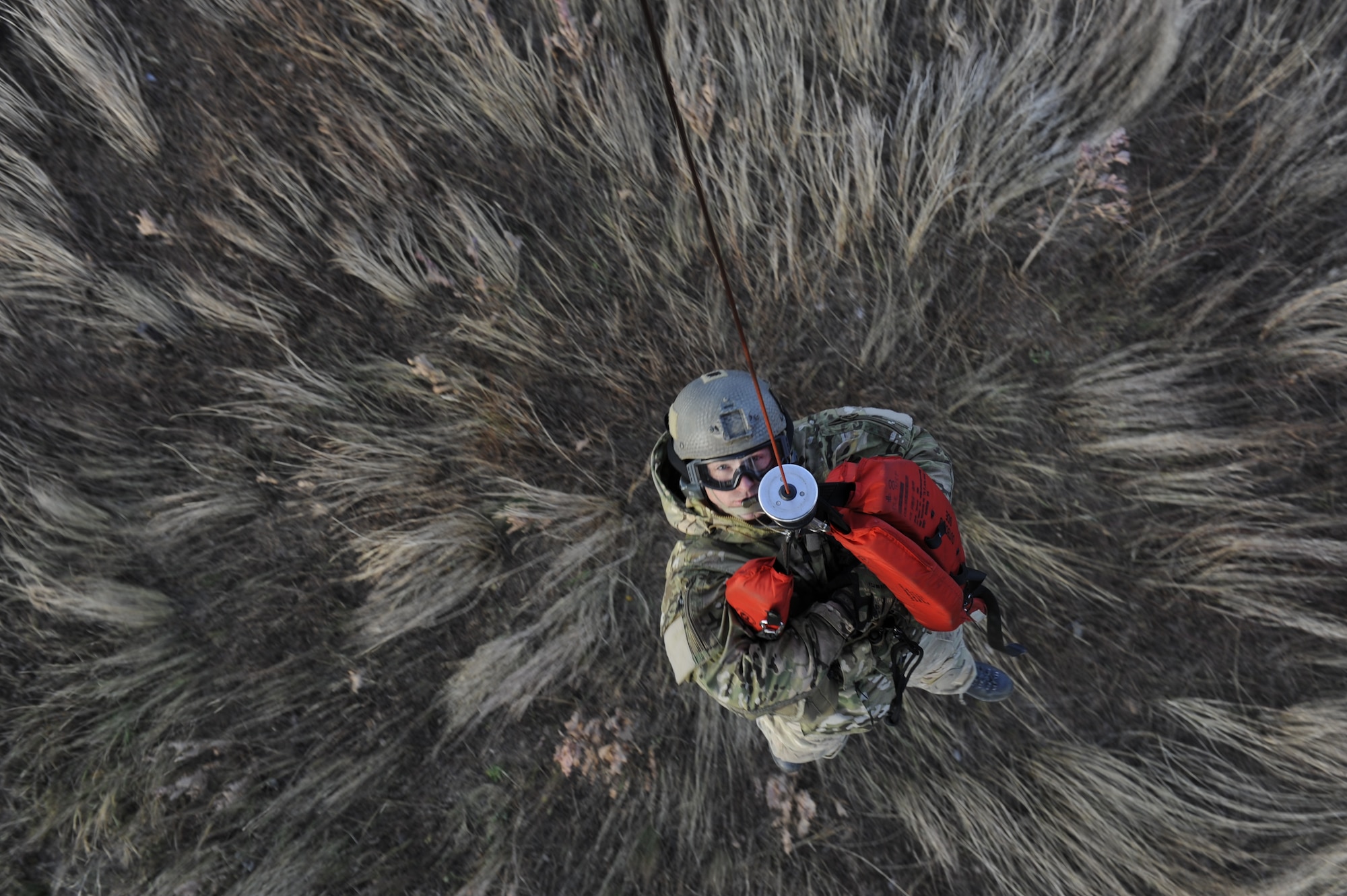 U.S. Air Force Staff Sgt. Robert Colliton, Survival Evasion Resistance Escape specialist from the 18th Operation Support Squadron on Kadena Air Base, Japan, is hoisted up to a rescue helicopter during exercise PACIFIC THUNDER Nov. 3 near Osan Air Base, Republic of Korea.
PACIFIC THUNDER is a 10-day exercise from Oct. 31 to Nov. 9 at Osan AB. The exercise involves the 33rd Rescue Squadron from Kadena AB, Japan, and the 25th Fighter Squadron from Osan. These units work together to practice combat search and rescue tactics to prepare for real-world emergency situations. (U.S. Air Force photo/Tech. Sgt. Angelique Bilog/released)
