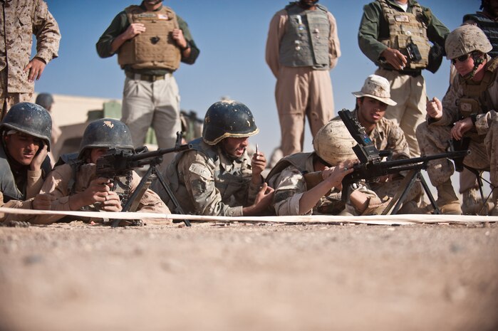 Students fire PKM general purpose machine guns during the firearms training portion of the Tactical Leaders Course aboard Camp Leatherneck, Helmand province, Nov. 1. The Joint Sustainment Academy Southwest has started a new course of training with various Afghan security forces with the idea of working together to accomplish a mission.