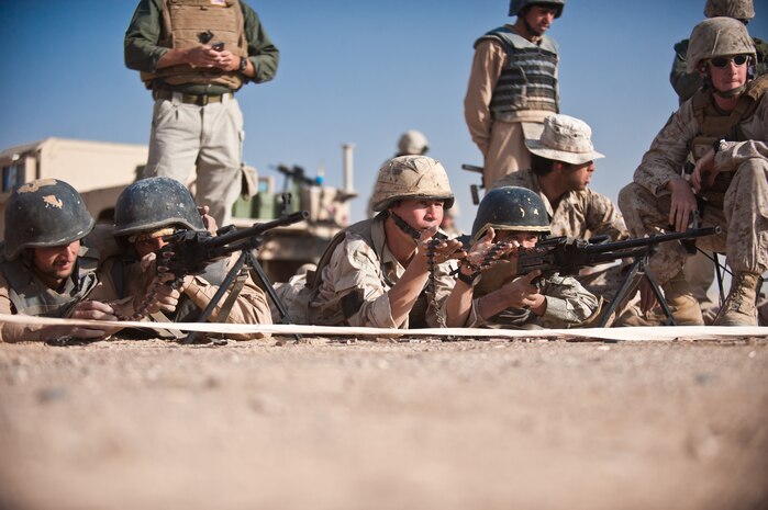 Students fire PKM general purpose machine guns during the firearms training portion of the Tactical Leaders Course aboard Camp Leatherneck, Helmand province, Nov. 1. The Joint Sustainment Academy Southwest has started a new course of training with various Afghan security forces with the idea of working together to accomplish a mission.