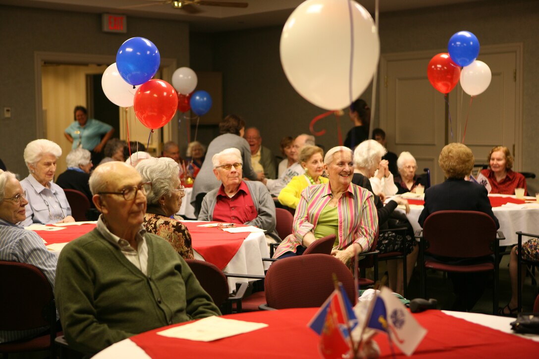 Generations of veterans gather at the Lambeth House to enjoy a Veterans Day celebration and a Marine Corps Birthday ceremony provided by the Molly Marine Chapter LA-1, Women Marines Association. (Photo by Pfc. Jessica DeRose)