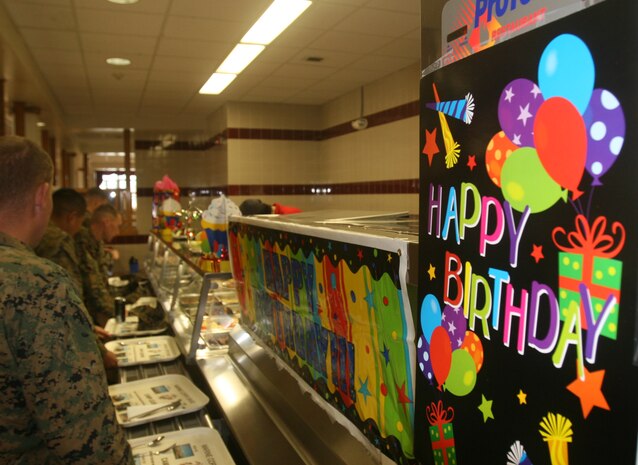 Marines stand in line to get food at Mess Hall 521 during a Marine Corps’ birthday celebration lunch aboard Camp Lejeune, N.C., Nov. 8, 2011.  During the event food service Marines prepared steak and lobster, as well as a cake for everyone attending the lunch. (Photo by Cpl. Bruno J. Bego)