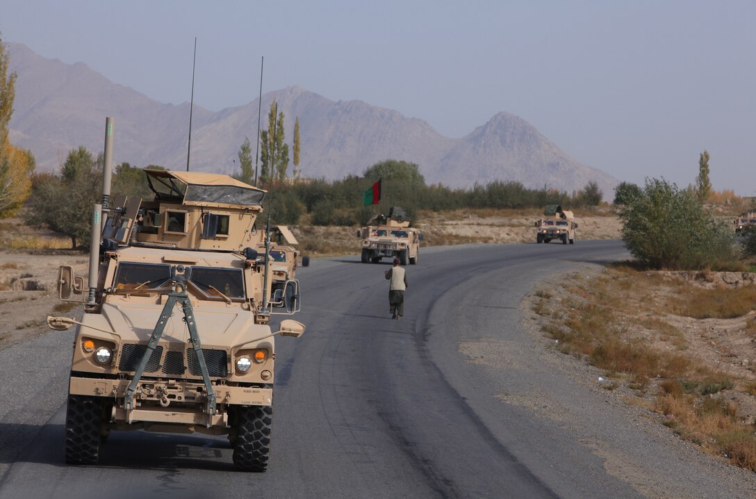 The 215th Corps Logistics Battalion, Afghan National Army soldiers and the Marines of Embedded Partnering Team, 2nd Marine Logistics Group (Forward), advances down the route from Kabul toward Camp Shorabak, Helmand province, Oct. 28. The EPT Marines and ANA soldiers traveled for six days in order to deliver the newly trained soldiers to Camp Shorabak in Helmand province for follow-on military training.