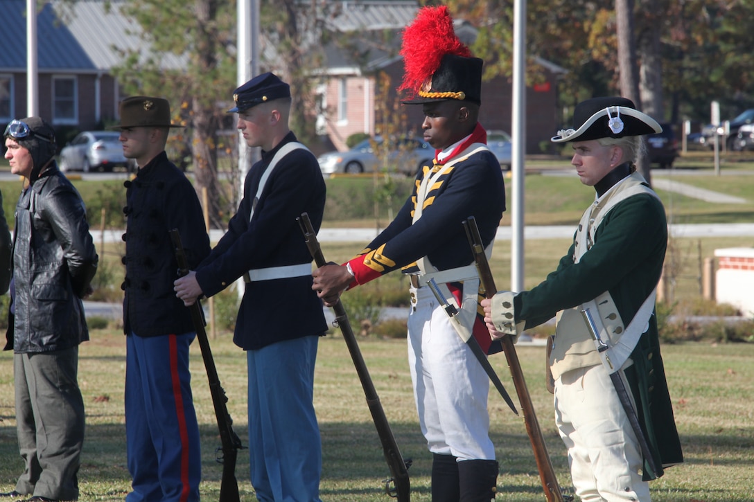 (Right to left) Marines dressed in uniforms the Revolutionary War, the War of 1812, The Civil War, the Spanish-American War and Boxer Rebellion stand at parade rest during the 236th Marine Corps Birthday Cake-cutting Ceremony and Historical Uniform Pageant in front of the Christian F. Schilt building Nov. 8. Marines and Sailors participating in the ceremony were dressed in different uniforms the Marine Corps and Navy have worn throughout history ranging from Continental Marines to present day Marines.