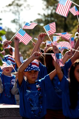 Students from Eglin Elementary show off their American pride during a Veterans Day ceremony at the All Wars Memorial at Eglin Air Force Base, Fla., Nov. 8.  (U.S. Air Force photo/Sachel Seabrook)
