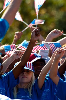 Students from Eglin Elementary show off their American pride during a Veterans Day ceremony at the All Wars Memorial at Eglin Air Force Base, Fla., Nov. 8.  (U.S. Air Force photo/Sachel Seabrook)