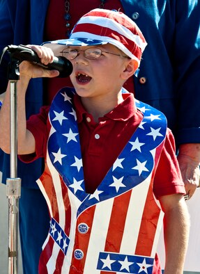 A young American recites "I am Your Flag" during the Veterans Day ceremony at the All Wars Memorial at Eglin Air Force Base, Fla., Nov. 8. More than 400 students attended the ceremony.   (U.S. Air Force photo/Sachel Seabrook)