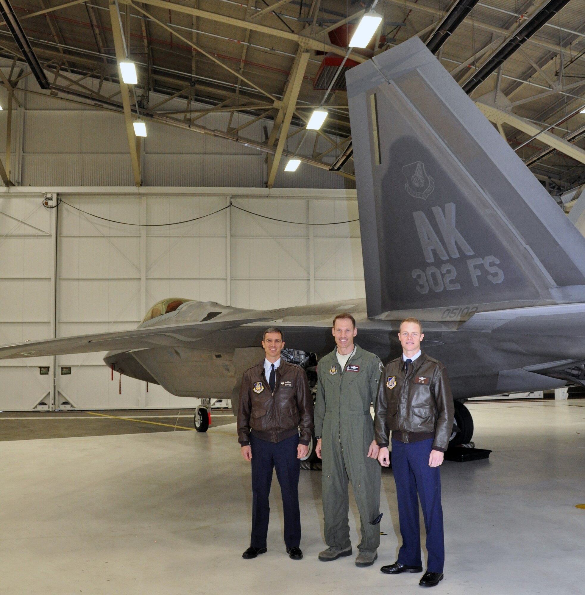 477th Fighter Group commander, 302nd Fighter Squadron commander, and 3rd Operations Group commander, pose for a photo.