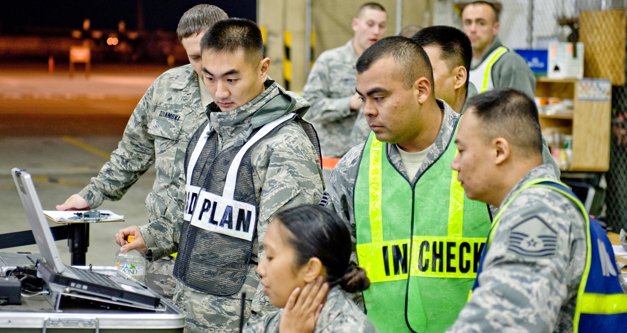YOKOTA AIR BASE, Japan -- Members of the 374th Logistics Readiness Squadron and the 374th Maintenance Squadron oversee cargo being weighed prior to transport during an operational readiness exercise at Yokota Air Base, Japan, Nov. 9, 2011. The two squadrons often work together to move cargo and equipment throughout the Pacific region. (U.S. Air Force photo/Airman John D. Partlow)