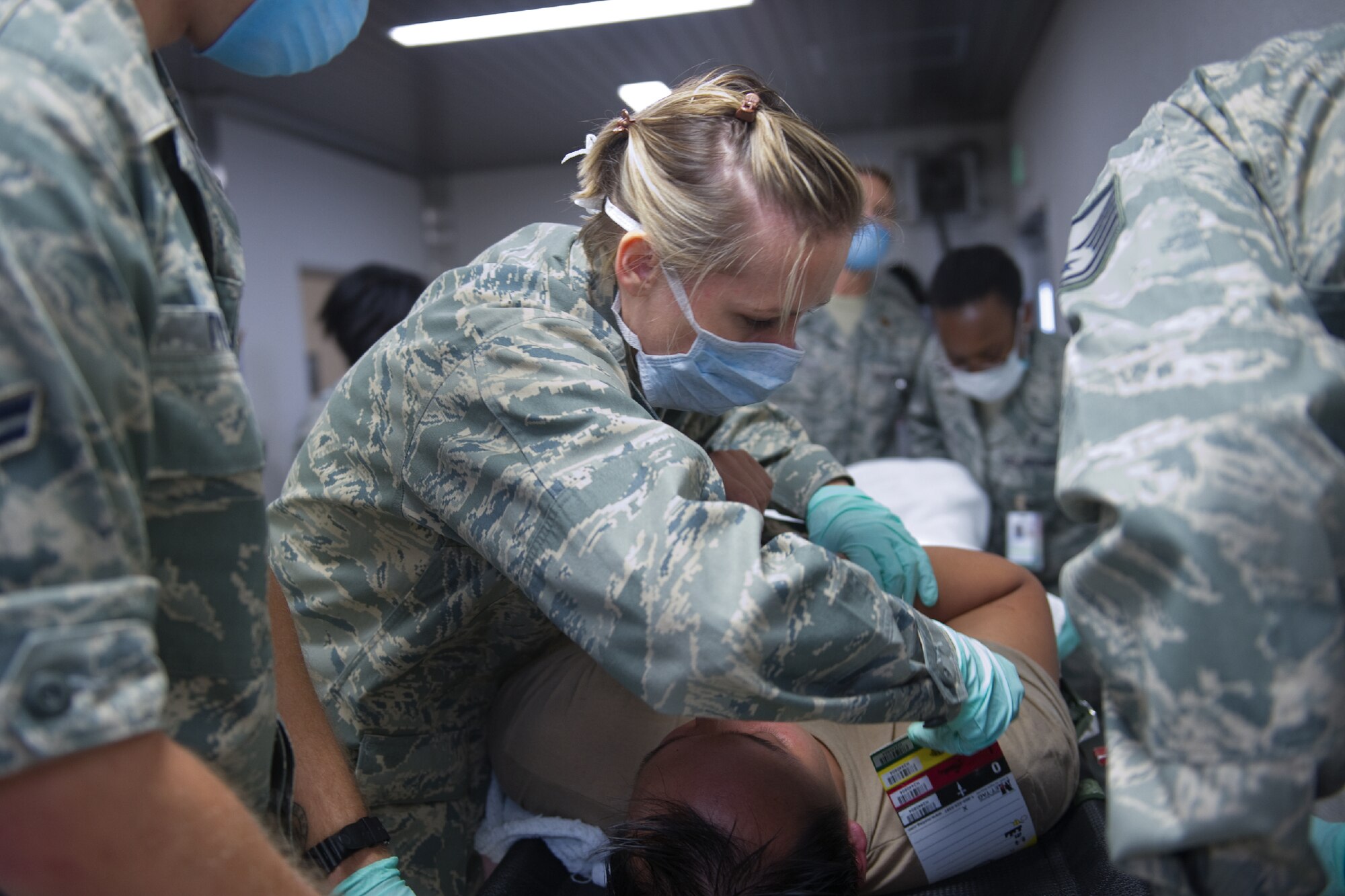 YOKOTA AIR BASE, Japan -- Major Stacy Zaikoski, 374th Dental Squadron pediatric dentist, performs TRIAGE on a simulated patient after decontamination procedures during a medical counter-chemical, biological, radiological and nuclear exercise scenario at Yokota Air Base, Japan, Nov. 4, 2011 . The training experience is valuable to Airmen because it tests their knowledge and ability on how to identify and react to CBRN agents. (U.S. Air Force photo/Osakabe Yasuo)