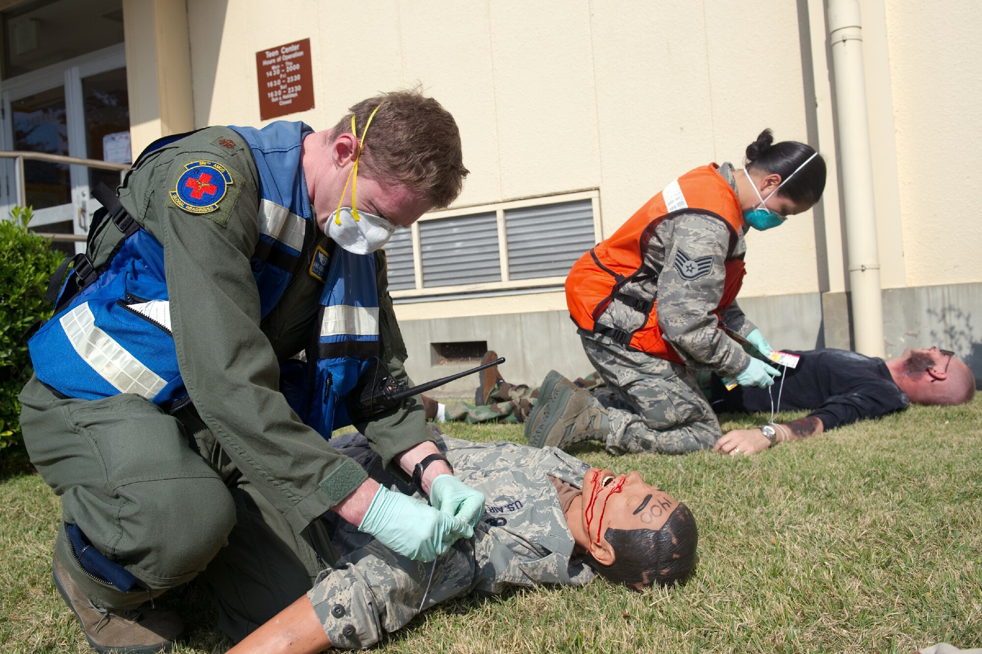 YOKOTA AIR BASE, Japan -- (Left to right) Maj. Erik Abrames and Staff Sgt. Erika Craig, both from the 374th Aerospace Medicine Squadron, perform TRIAGE on simulated patients during a medical counter-chemical, biological, radiological and nuclear exercise scenario at Yokota Air Base, Japan, Nov. 4, 2011. The training experience is valuable to Airmen because it tests their knowledge and ability to identify and react to CBRN agents. (U.S. Air Force photo/Osakabe Yasuo)