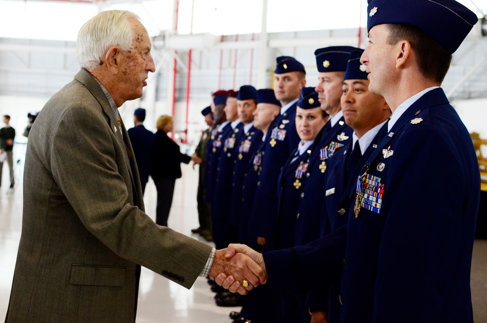 Lt. Col. Jay Craddock (retired) presents the Distinguished Flying Cross with Valor to Airmen at Moffett Federal Airfield, Calif., Nov. 5, 2011. Craddock is a former group commander at the 129th Rescue Wing. 129th Rescue Wing Airmen heroically performed combat rescue missions in Afghanistan, often under hostile fire, in 2009 and 2010. Because of these actions they received the Distinguished Flying Cross, a medal awarded to servicemembers who distinguish themselves in support of operations by heroism or extraordinary achievement while participating in an aerial flight. (Air National Guard photo by Airman 1st Class John Pharr)