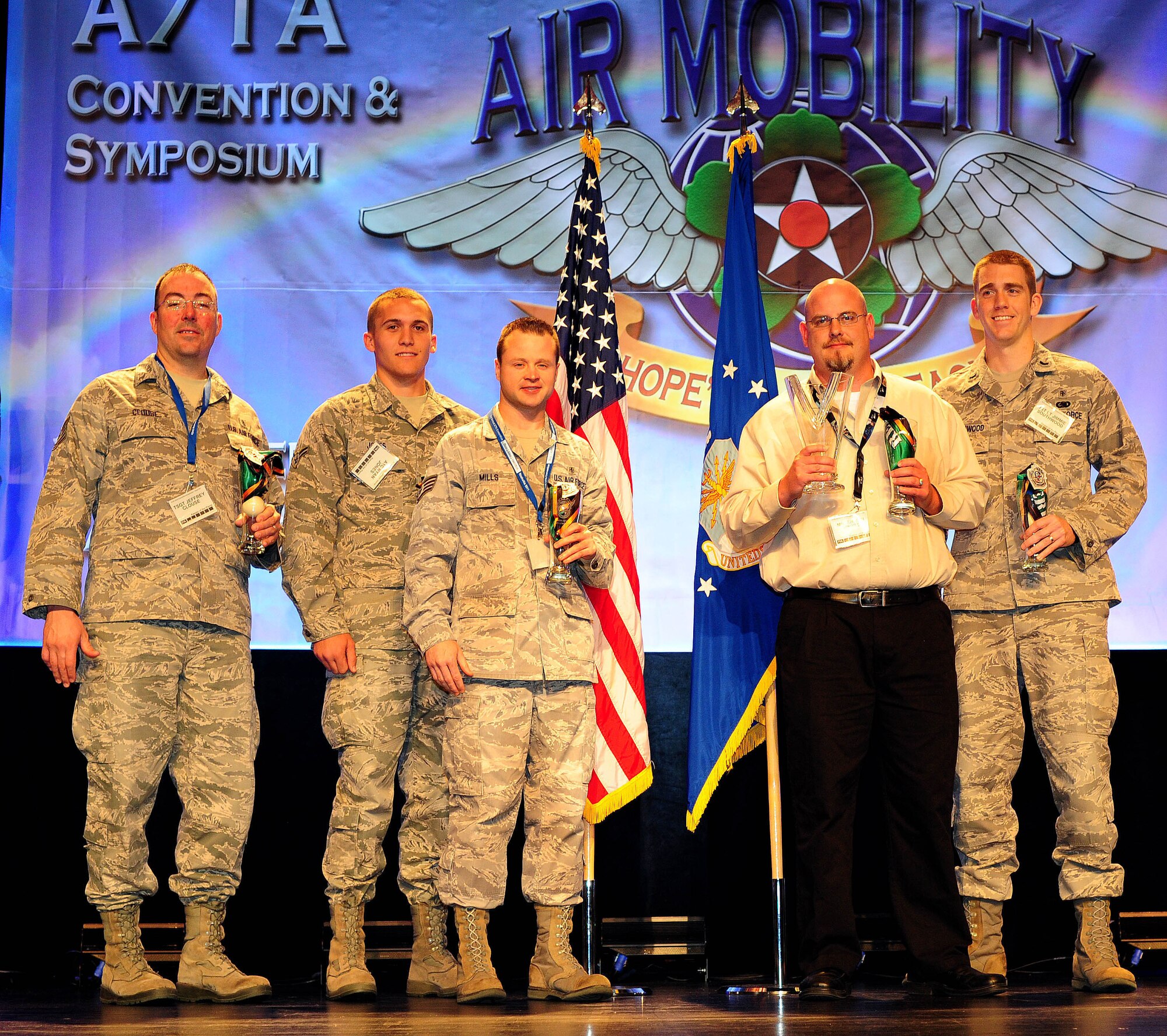 McConnell "white" team takes first place during the 10th Annual Crud Tournament Nov. 5, 2011, at the 43rd Annual Airlift/Tanker Association Convention and Symposium, Nashville, Tenn. Tech. Sgt. Jeff Clouse, Airman 1st Class Ryan Jones, Staff Sgt. Dan Mills, Mr. Shawn Hinkle and 1st Lt. Jimmy Southwood recieved glasses, scarves and patches for their win. (U.S. Air Force photo/Senior Airman Courtney Witt)