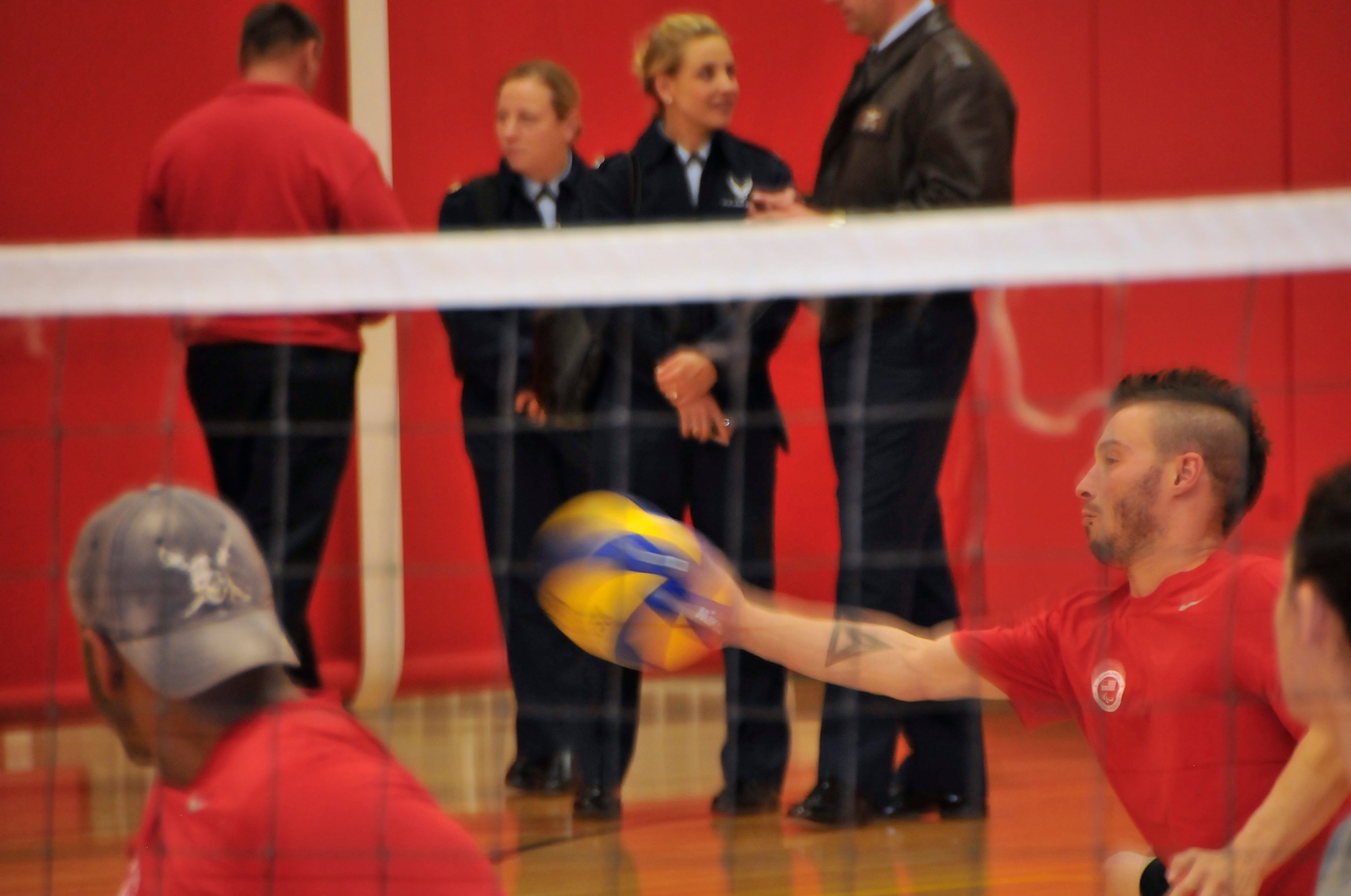 Zachary Martinez, one of the 15 athletes participating in the Air Force’s Adaptive Sports Wounded Warrior Mini Camp, serves the ball during a practice game of seated volleyball, Nov. 4. The camp was held at the OTC and the U.S. Air Force Academy, and ran from Nov. 3 to 6. (U.S. Air Force Photo/ Capt. George Tobias)