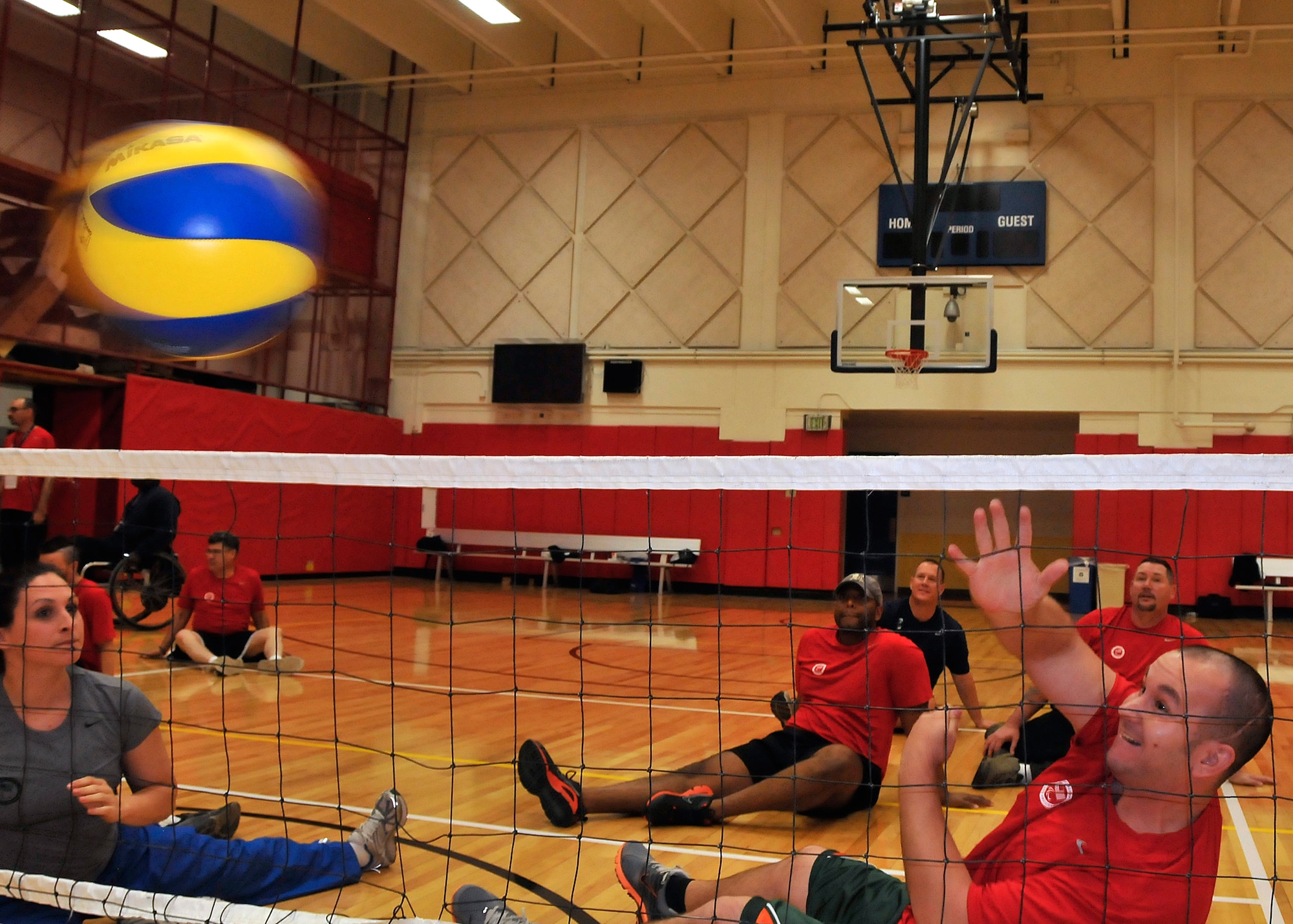 Retired Staff Sgt. Kevin Taylor learns how to spike during seated volleyball practice, part of an Adaptive Sports Wounded Warrior Mini Camp held by the Air Force at the Olympic Training Center and the U.S. Air Force Academy, Nov. 4. The camp ran from Nov. 3 to 6. (U.S. Air Force Photo/ Capt. George Tobias)