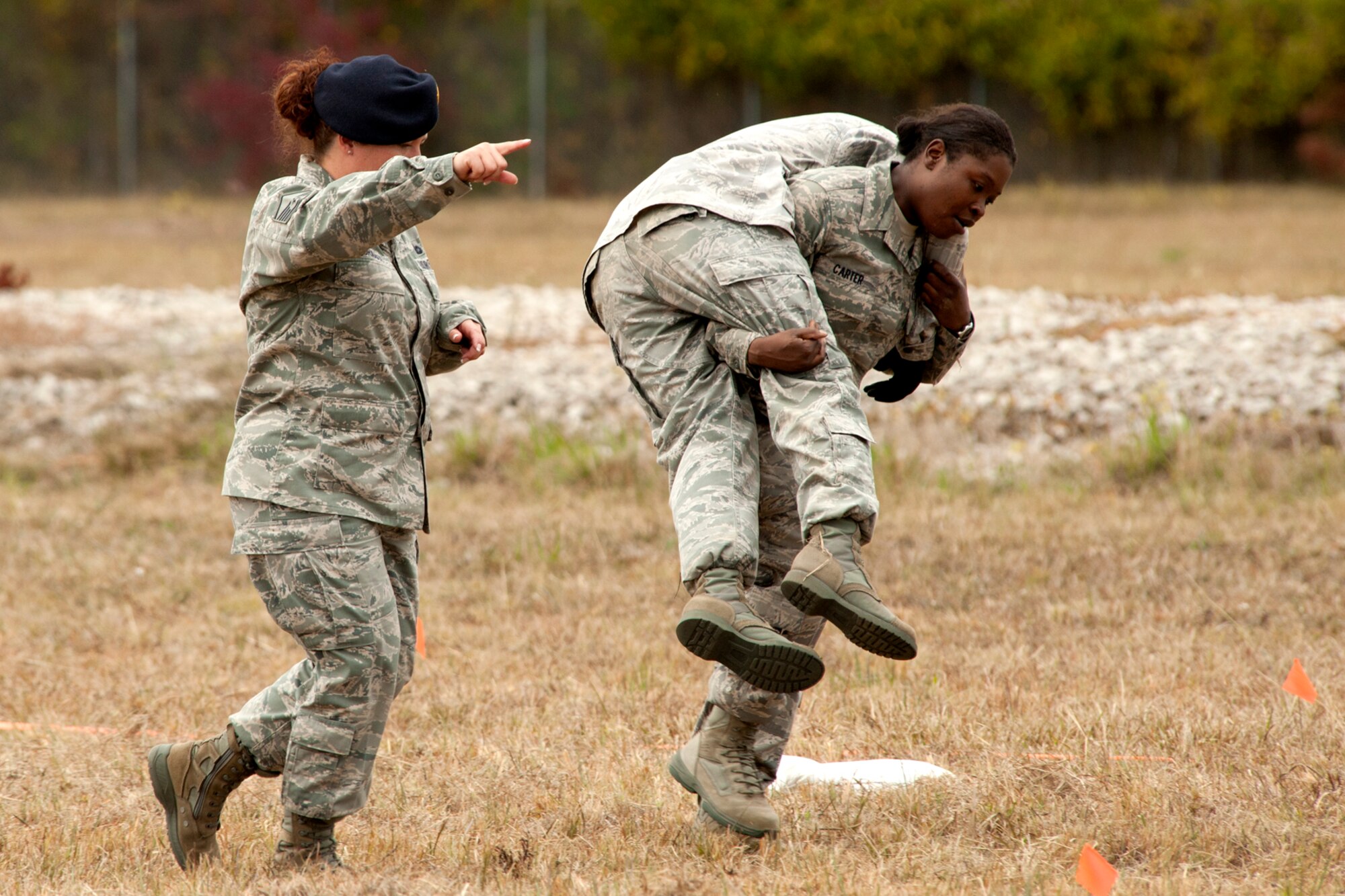 U.S. Air Force Airman 1st Class Nikili Carter, 307th Security Forces Squadron, uses the Fireman Carry technique on a teammate during the Mental and Physical (MAP) competition during Global Strike Challenge, Barksdale Air Force Base, La., Nov. 7, 2011. Teams competing in the event were not allowed to know the details of the competition, which included grueling physical and logic scenarios. (U.S. Air Force photo by Master Sgt. Greg Steele/Released)