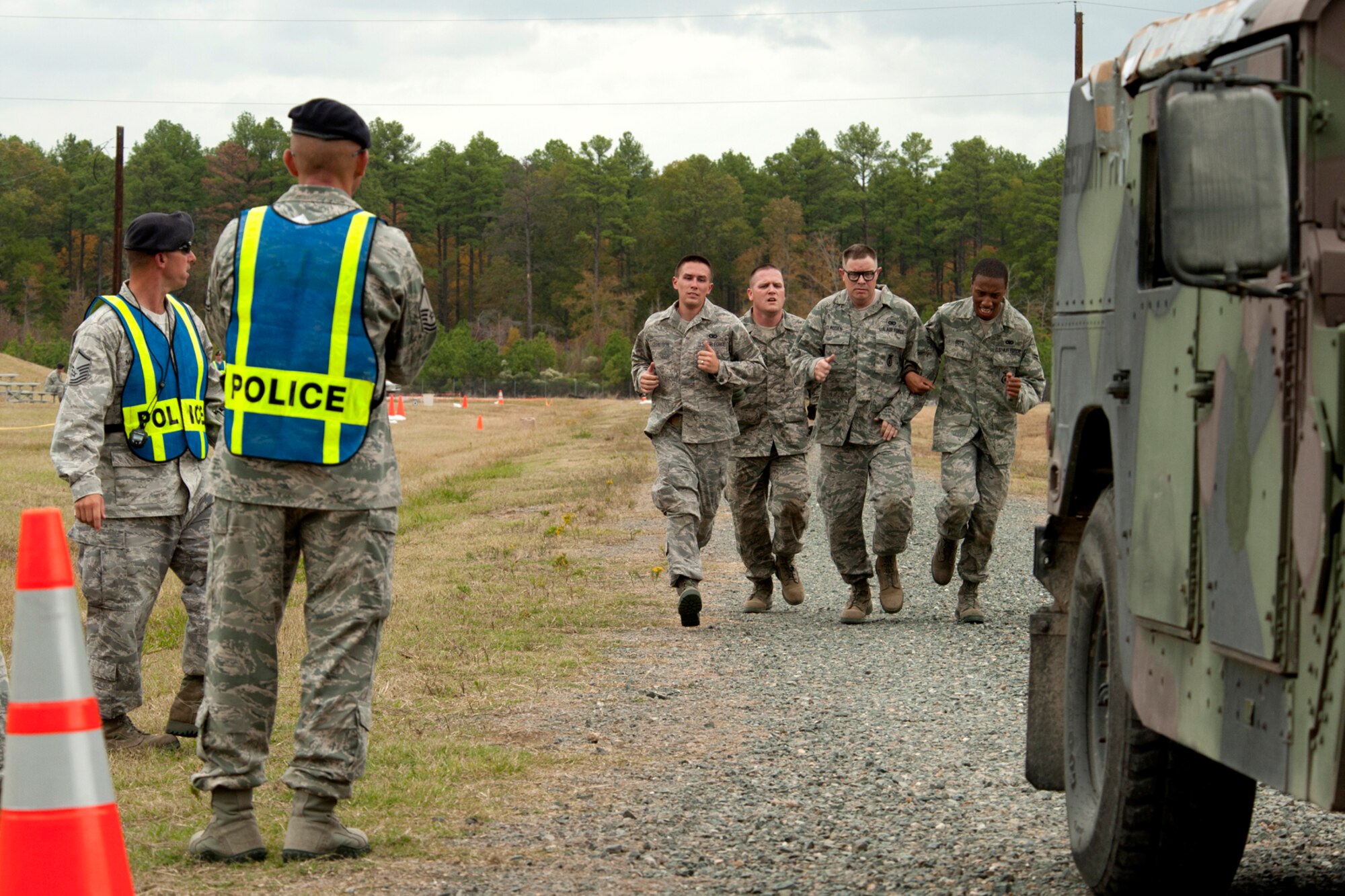Members of the 307th Security Forces Squadron run the last leg of the Mental and Physical competition during Global Strike Challenge, Barksdale Air Force Base, La., Nov. 7, 2011. The Global Strike Challenge is the world's premiere bomber, Intercontinental Ballistic Missile and security forces competition with units from Air Force Global Strike Command, Air Combat Command, Air Force Reserve Command and the Air National Guard. (U.S. Air Force photo by Master Sgt. Greg Steele/Released)