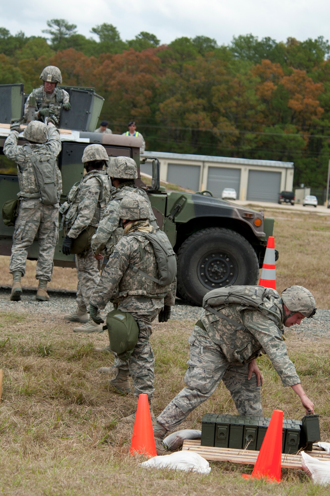 Members of the 307th Security Forces Squadron, unload and stack filled ammo boxes during the Mental and Physical (MAP) competition for the Global Strike Challenge, Barksdale Air Force Base, La., Nov. 7, 2011. The Global Strike Challenge is the world's premiere bomber, Intercontinental Ballistic Missile and security forces competition with units from Air Force Global Strike Command, Air Combat Command, Air Force Reserve Command and the Air National Guard. (U.S. Air Force photo by Master Sgt. Greg Steele/Released)
