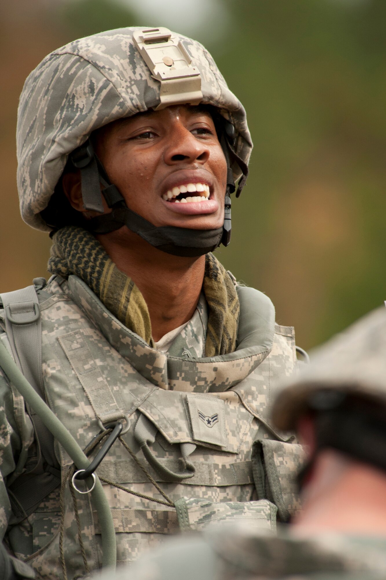 U.S. Air Force Airman 1st Class Stephen Boyd, 307th Security Forces Squadron, catches his breath after completing a task during the Mental and Physical (MAP) competition for the Global Strike Challenge, Barksdale Air Force Base, La., Nov. 7, 2011. The MAP competition consisted of grueling physical and logical scenarios, requiring both teamwork and individual strength to complete. (U.S. Air Force photo by Master Sgt. Greg Steele/Released)