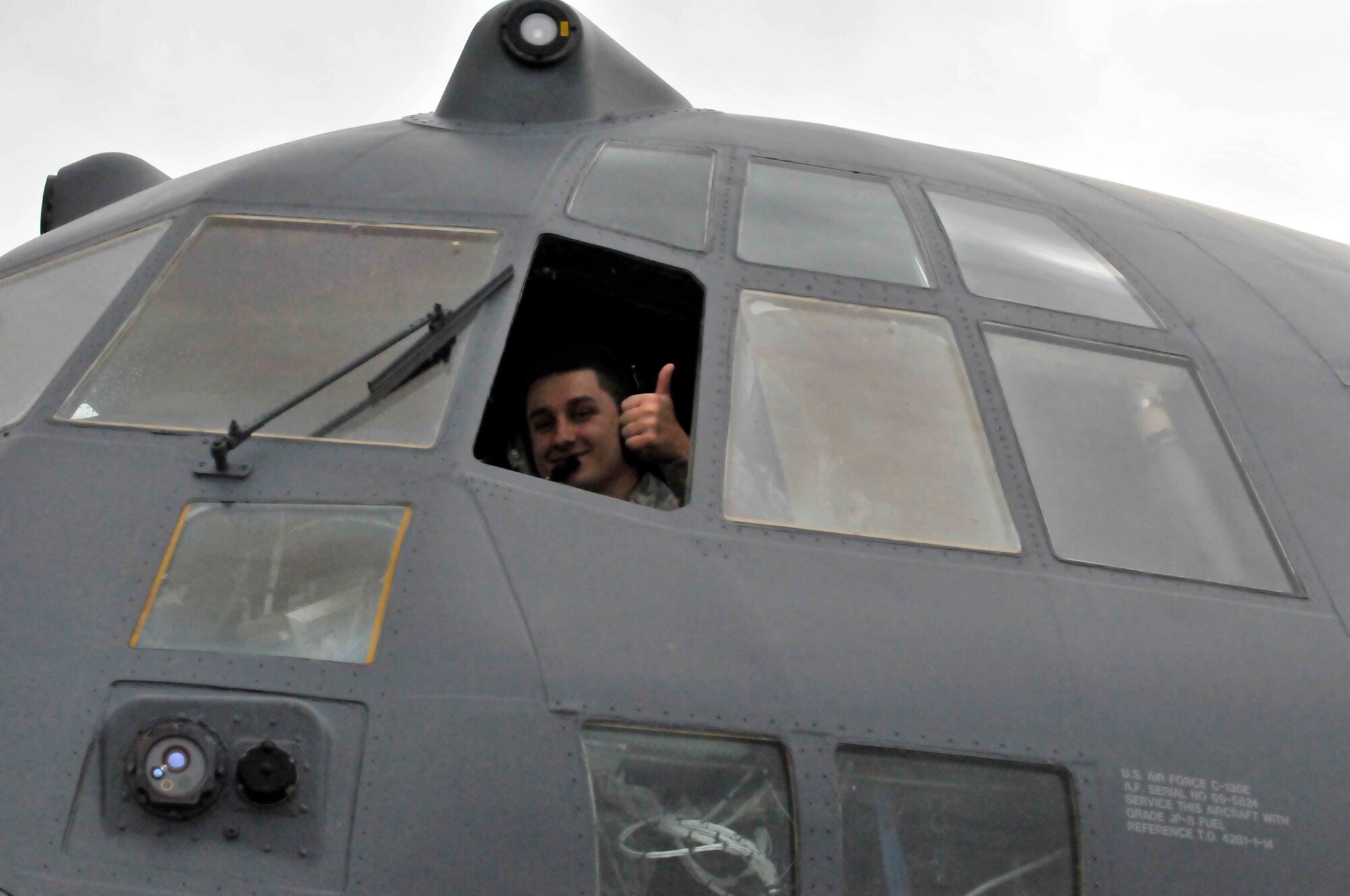 PATRICK AIR FORCE BASE, Fla. - Senior Airmen Gary Woodward, 920th Rescue Wing Maintenance Airman, gives a thumbs up following a positive operations check of the radio equipment on an HC-130P/N King aircraft here. The maintainers run checks before each flight to prepare the aircraft for their demonstration in the Cocoa Beach Air Show Nov. 4-5. (U.S. Air Force Photo/Capt. Ryan Liss)