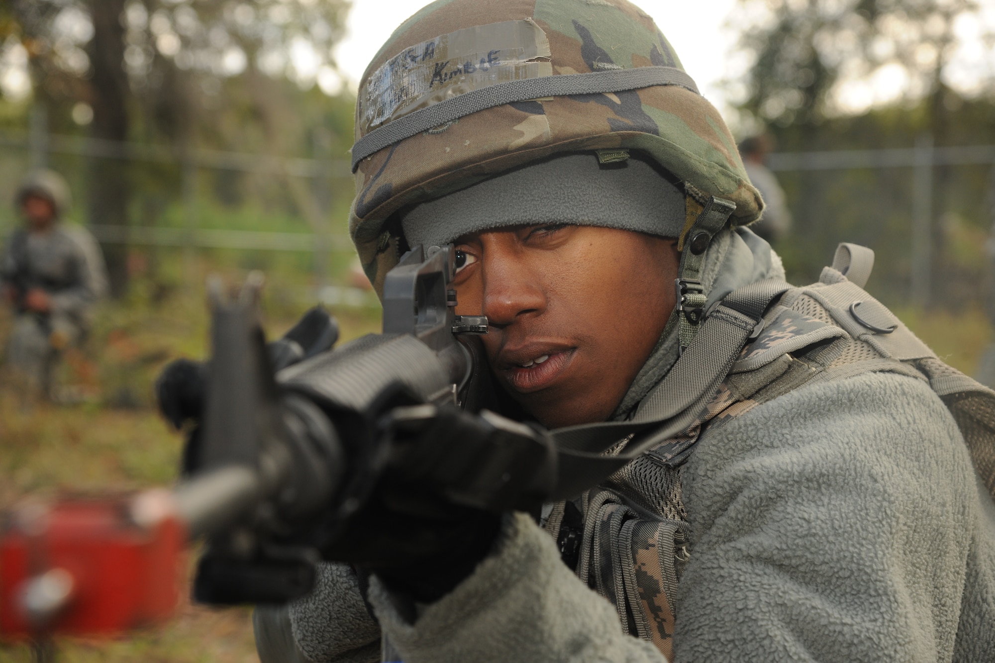 U.S. Air Force Senior Airman Paris Kimble, 23rd Civil Engineer Squadron heating, ventilation, air conditioning and refrigeration journeyman, looks down his sights during Prime Base Engineer Emergency Forces training at Moody Air Force Base, Ga., Nov. 4, 2011. Kimble’s role during the training was to give supporting fire as other members identified simulated enemy targets. (U.S. Air Force photo by Airman 1st Class Paul Francis/Released)
