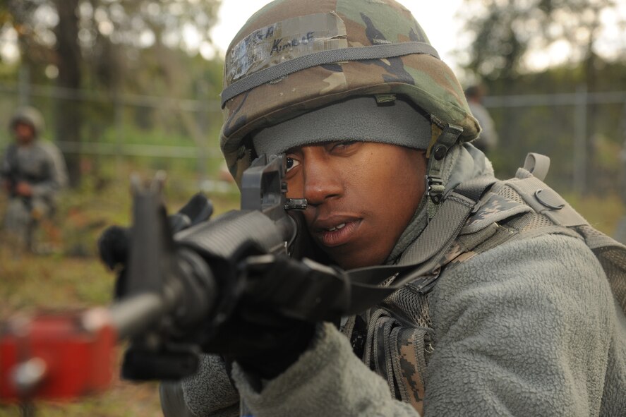 U.S. Air Force Senior Airman Paris Kimble, 23rd Civil Engineer Squadron heating, ventilation, air conditioning and refrigeration journeyman, looks down his sights during Prime Base Engineer Emergency Forces training at Moody Air Force Base, Ga., Nov. 4, 2011. Kimble’s role during the training was to give supporting fire as other members identified simulated enemy targets. (U.S. Air Force photo by Airman 1st Class Paul Francis/Released)
