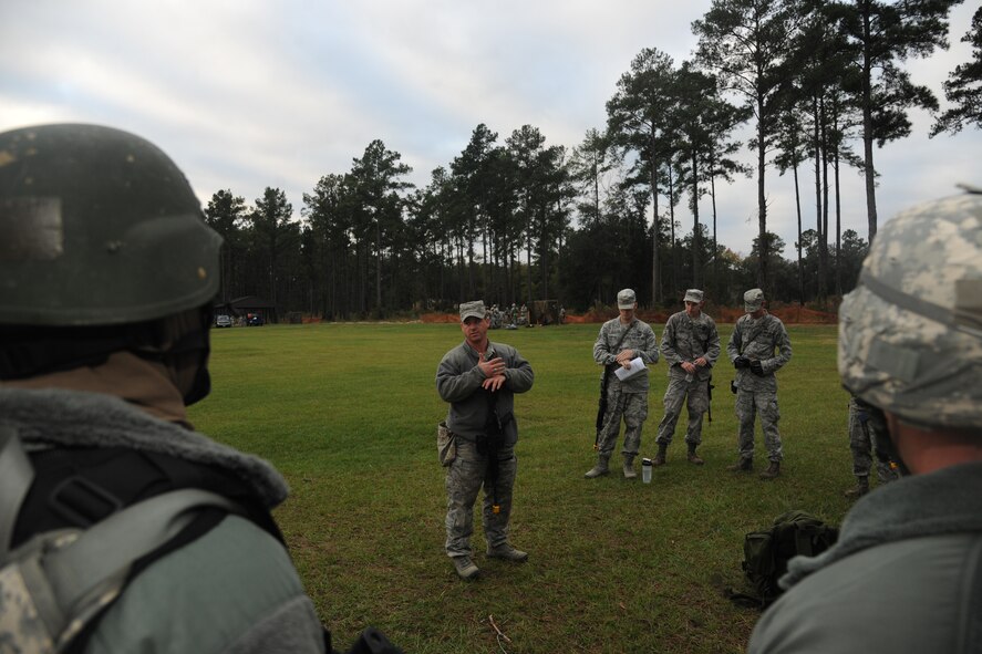 U.S. Air Force Tech Sgt. Jason Kreider, 23rd Civil Engineer Squadron explosive ordnance disposal craftsman, leads a lesson on tactical movements during Prime Base Engineer Emergency Forces training at Moody Air Force Base, Ga., Nov. 4, 2011. Teams also learned how to man defensive fighting positions and perform road checks to stop enemies. Approximately 85 members of the 23rd CES participated in the training. (U.S. Air Force photo by Airman 1st Class Paul Francis/Released)
