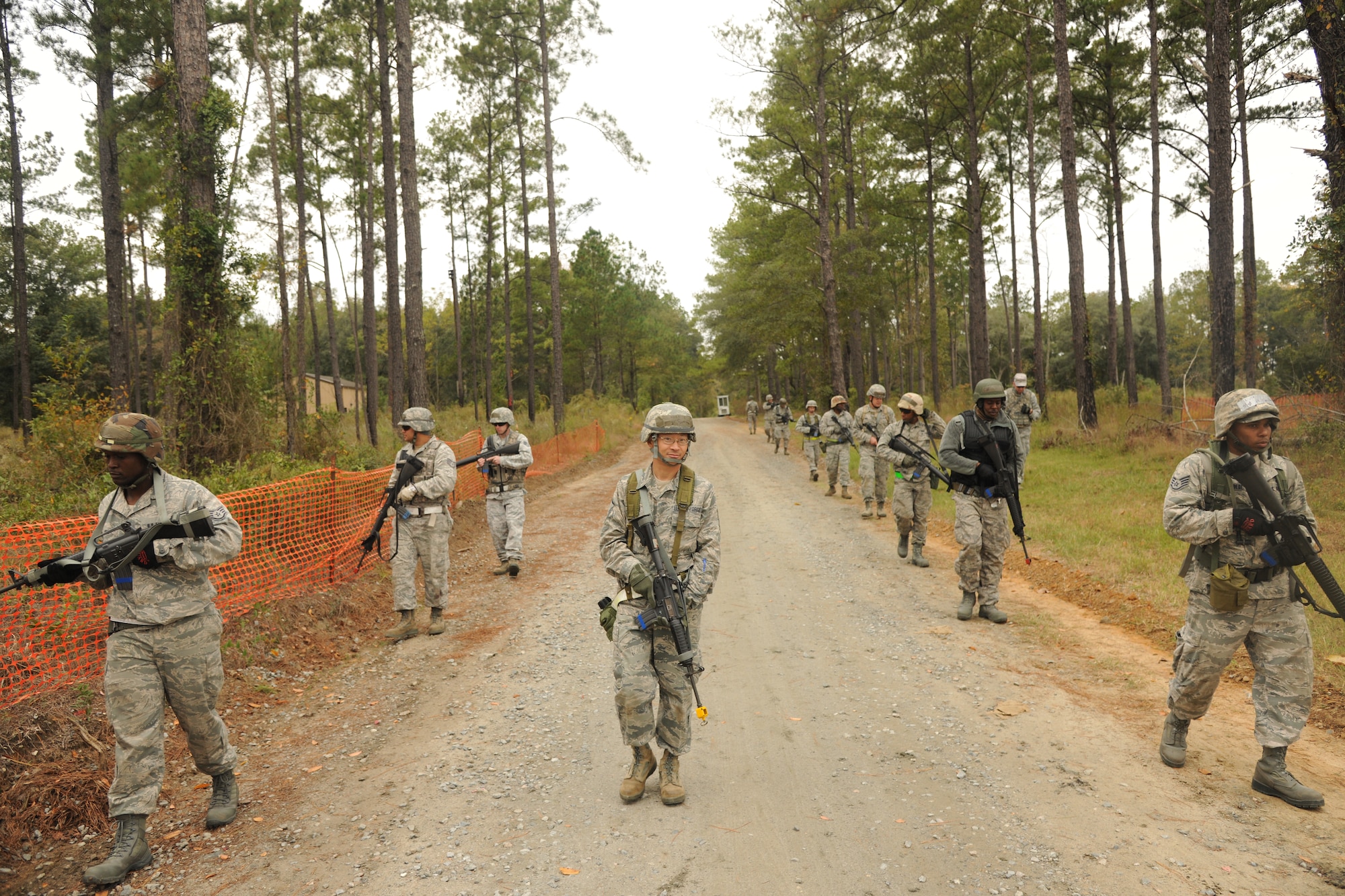 Members of the 23rd Civil Engineer Squadron march in a staggered formation as they practice road patrols at Moody Air Force Base, Ga., Nov. 4, 2011. The purpose of the training was to identify improvised explosive devices and react to road side threats. (U.S. Air Force photo by Airman 1st Class Paul Francis/Released)
