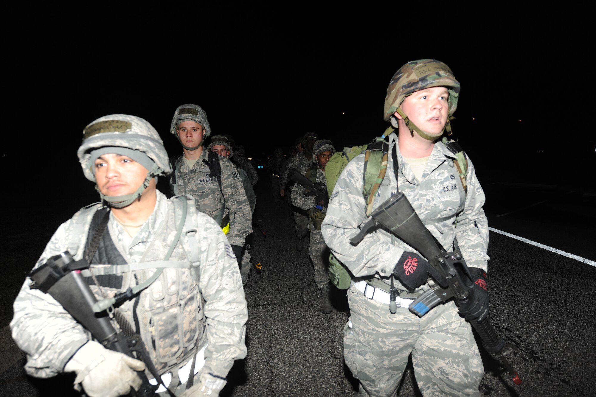 Members of the 23rd Civil Engineer Squadron,
ruck march  towards a field training exercise site at Moody Air Force Base, Ga., Nov. 4, 2011. Four teams from the 23rd CES marched approximately five miles to the FTX site where they began their Prime Base Engineer Emergency Forces training.  Prime BEEF exercises are conducted monthly for 23rd CES members to stay current on training requirements and train for possible real-world combat threats and natural disaster relief efforts. (U.S. Air Force photo by Airman 1st Class Paul Francis/Released) 
