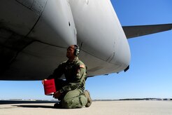 Staff Sgt. Kevin Sumlin performs a pre-flight inspection on a C-17 Globemaster III before a mission at  Joint Base Charleston - Air Base Nov. 2.  The Flying Crew Chiefs Office is a special duty assignment designed to provide a flying mission with a single-person maintenance package. Sumlin is a Flying Crew Chief with the 437th Aircraft Maintenance Squadron.  (U.S. Air Force photo/ Staff Sgt. Nicole Mickle) 