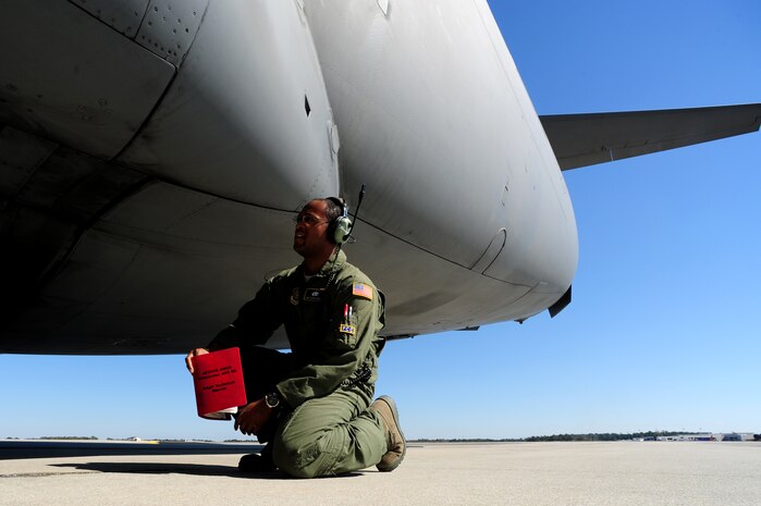Staff Sgt. Kevin Sumlin performs a pre-flight inspection on a C-17 Globemaster III before a mission at  Joint Base Charleston - Air Base Nov. 2.  The Flying Crew Chiefs Office is a special duty assignment designed to provide a flying mission with a single-person maintenance package. Sumlin is a Flying Crew Chief with the 437th Aircraft Maintenance Squadron.  (U.S. Air Force photo/ Staff Sgt. Nicole Mickle) 