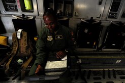 Staff Sgt. Kevin Sumlin troubleshoots an issue onboard a C-17 Globemaster III before a mission at Joint Base Charleston Nov. 2.  Flying Crew Chiefs are trained in many specialized aircraft maintenance skills and provide universal support as the lone maintainer to fix most aircraft issues that may occur during a flying mission. Sumlin is flying crew chief with the 437th Aircraft Maintenance Squadron.  (U.S. Air Force photo/ Staff Sgt. Nicole Mickle)  