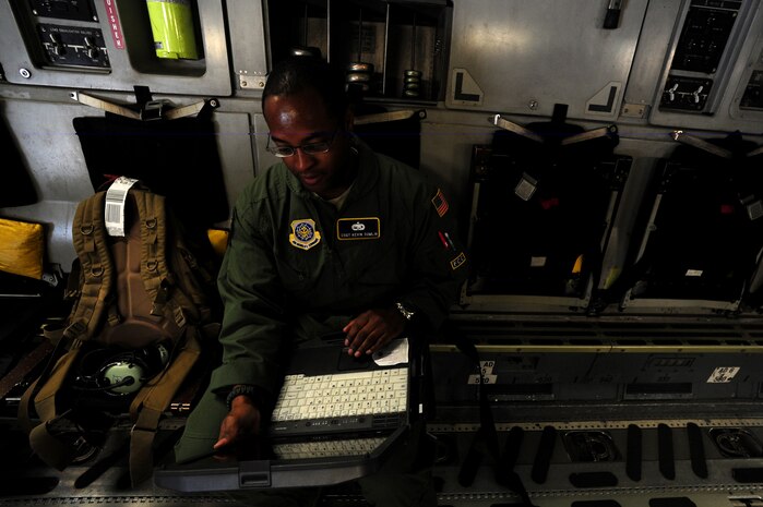 Staff Sgt. Kevin Sumlin troubleshoots an issue onboard a C-17 Globemaster III before a mission at Joint Base Charleston Nov. 2.  Flying Crew Chiefs are trained in many specialized aircraft maintenance skills and provide universal support as the lone maintainer to fix most aircraft issues that may occur during a flying mission. Sumlin is flying crew chief with the 437th Aircraft Maintenance Squadron.  (U.S. Air Force photo/ Staff Sgt. Nicole Mickle)  
