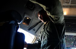Staff Sgt. Kevin Sumlin troubleshoots an issue onboard a C-17 Globemaster III before a mission at Joint Base Charleston - Air Base, Nov. 2.  The Flying Crew Chiefs Office is a special duty assignment designed to provide a flying mission with a single-person maintenance package. Sumlin is a flying crew chief with the 437th Aircraft Maintenance Squadron.  (U.S. Air Force photo/ Staff Sgt. Nicole Mickle)  