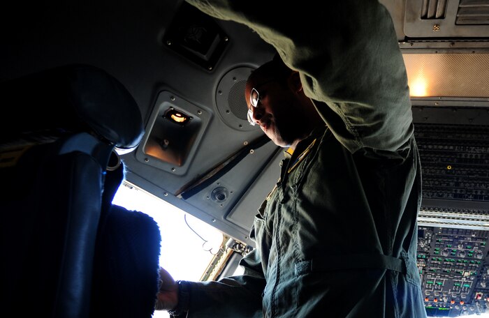 Staff Sgt. Kevin Sumlin troubleshoots an issue onboard a C-17 Globemaster III before a mission at Joint Base Charleston - Air Base, Nov. 2.  The Flying Crew Chiefs Office is a special duty assignment designed to provide a flying mission with a single-person maintenance package. Sumlin is a flying crew chief with the 437th Aircraft Maintenance Squadron.  (U.S. Air Force photo/ Staff Sgt. Nicole Mickle)  