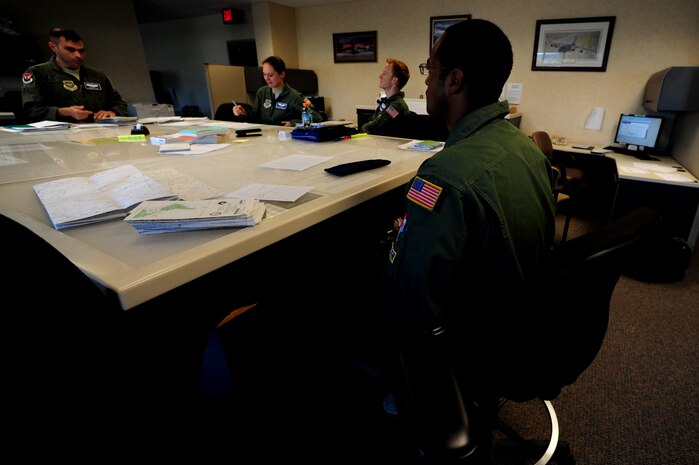 Staff Sgt. Kevin Sumlin attends a crew brief before a mission at Joint Base Charleston, Nov. 2.  The Flying Crew Chiefs Office is a special duty assignment designed to provide a flying mission with a single-person maintenance package.  Sumlin is a flying crew chief with the 437th Aircraft Maintenance Squadron.  (U.S. Air Force photo/ Staff Sgt. Nicole Mickle)  