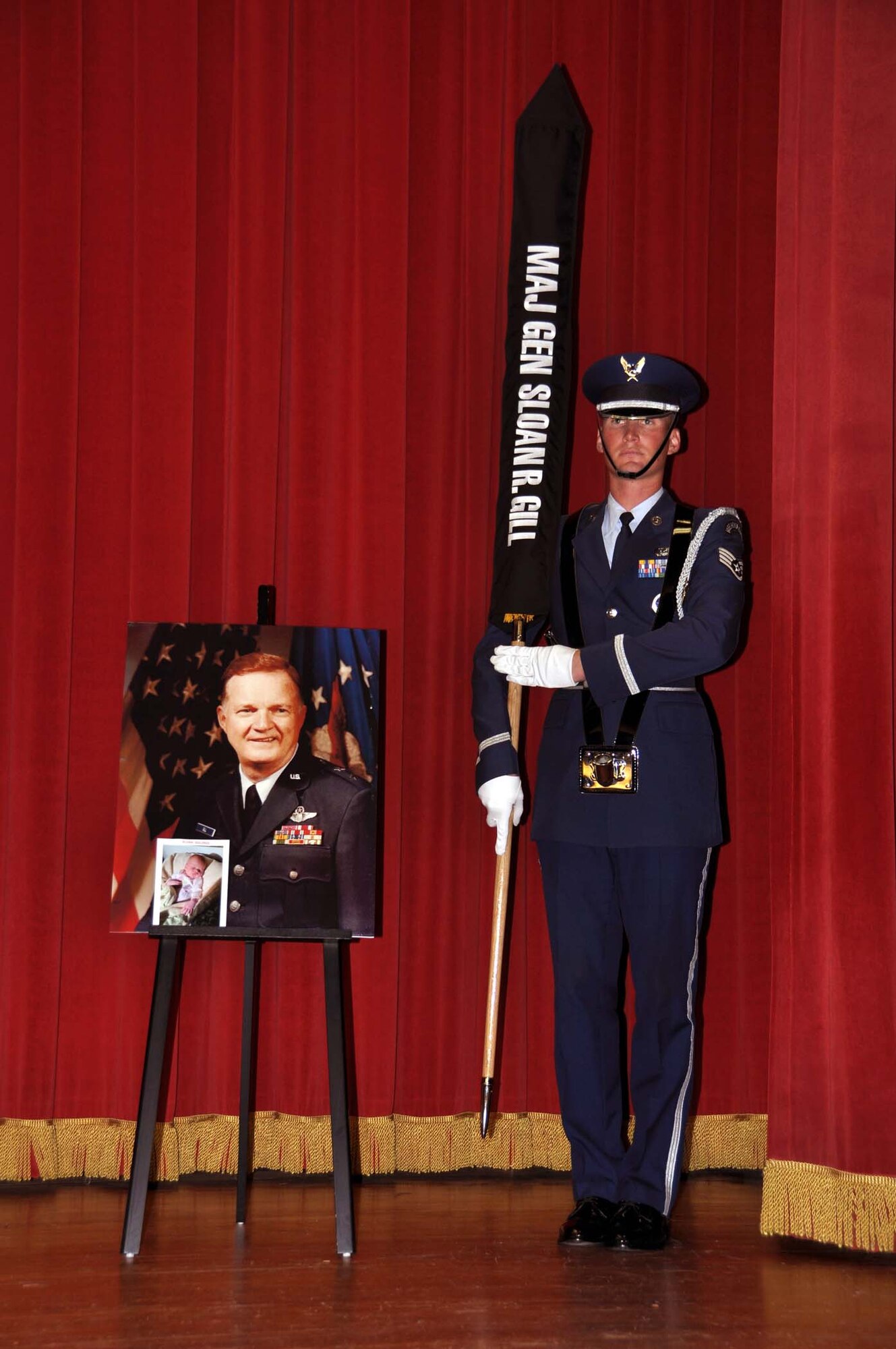Staff Sgt. Paul Connors, 95th Force Support Squadron and Blue Eagle’s Total Force Honor Guard member, holds retired Maj. Gen. Sloan R. Gill's personal colors after they were encased for the last time at the general's memorial service held at March Air Reserve Base, Calif. Nov 6, 2011.  Gill was a former chief of the Air Force Reserve and former commander of Air Force Reserve Command.  (U.S. Air Force photo/Master Sgt. Linda Welz)