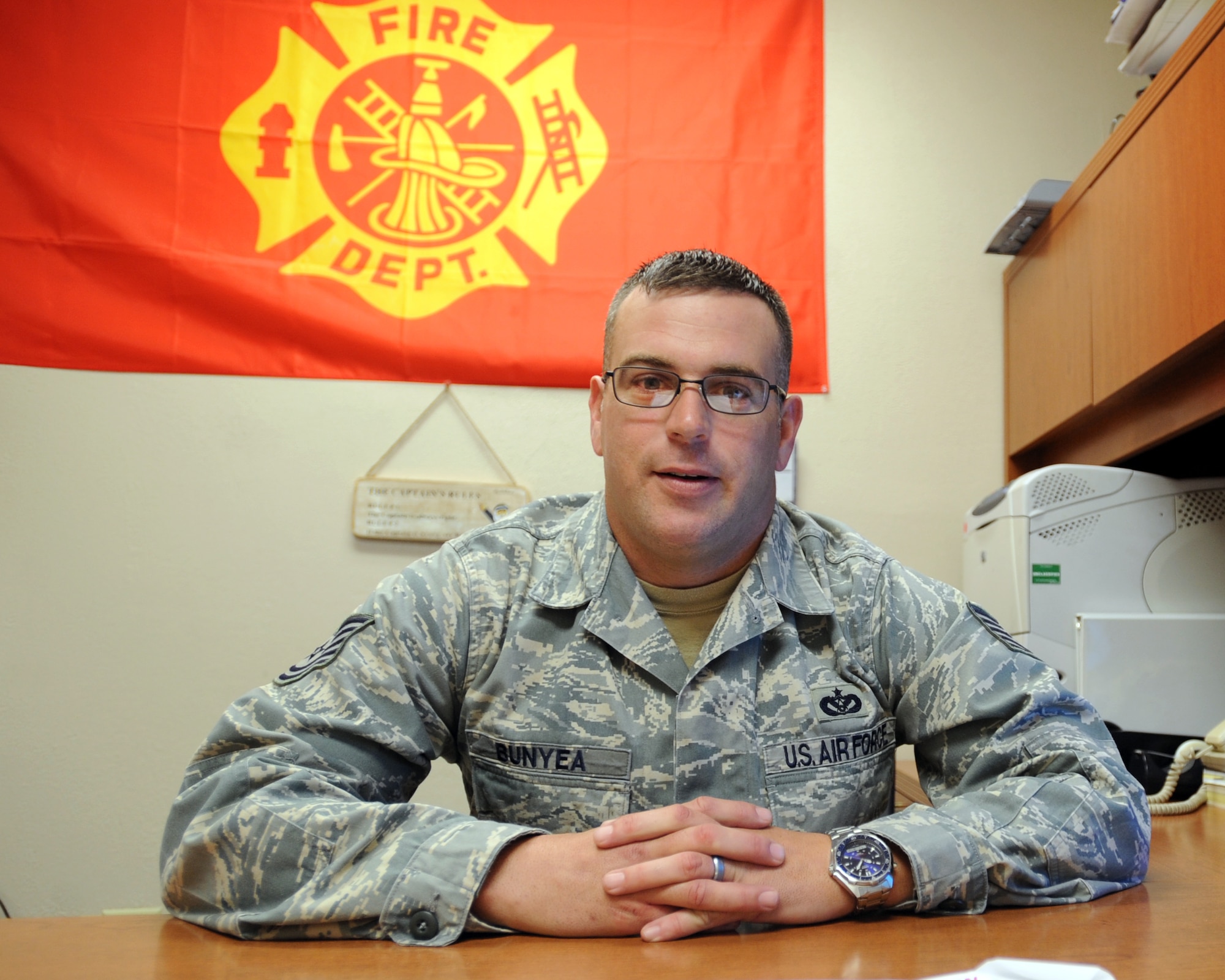 U.S. Air Force Tech. Sgt. Aaron Bunyea, 20th Civil Engineer Squadron station B-shift captain, poses for a safety award photo at Shaw Air Force Base, S.C., Nov. 8, 2011. Bunyea won the military 2011 Geico Public Service Award for his outstanding performance of being in charge of all manning, training, truck assignments and supervising 28 Airmen. (U.S. Air Force photo by Airman 1st Class Tabatha Duarte/Released)