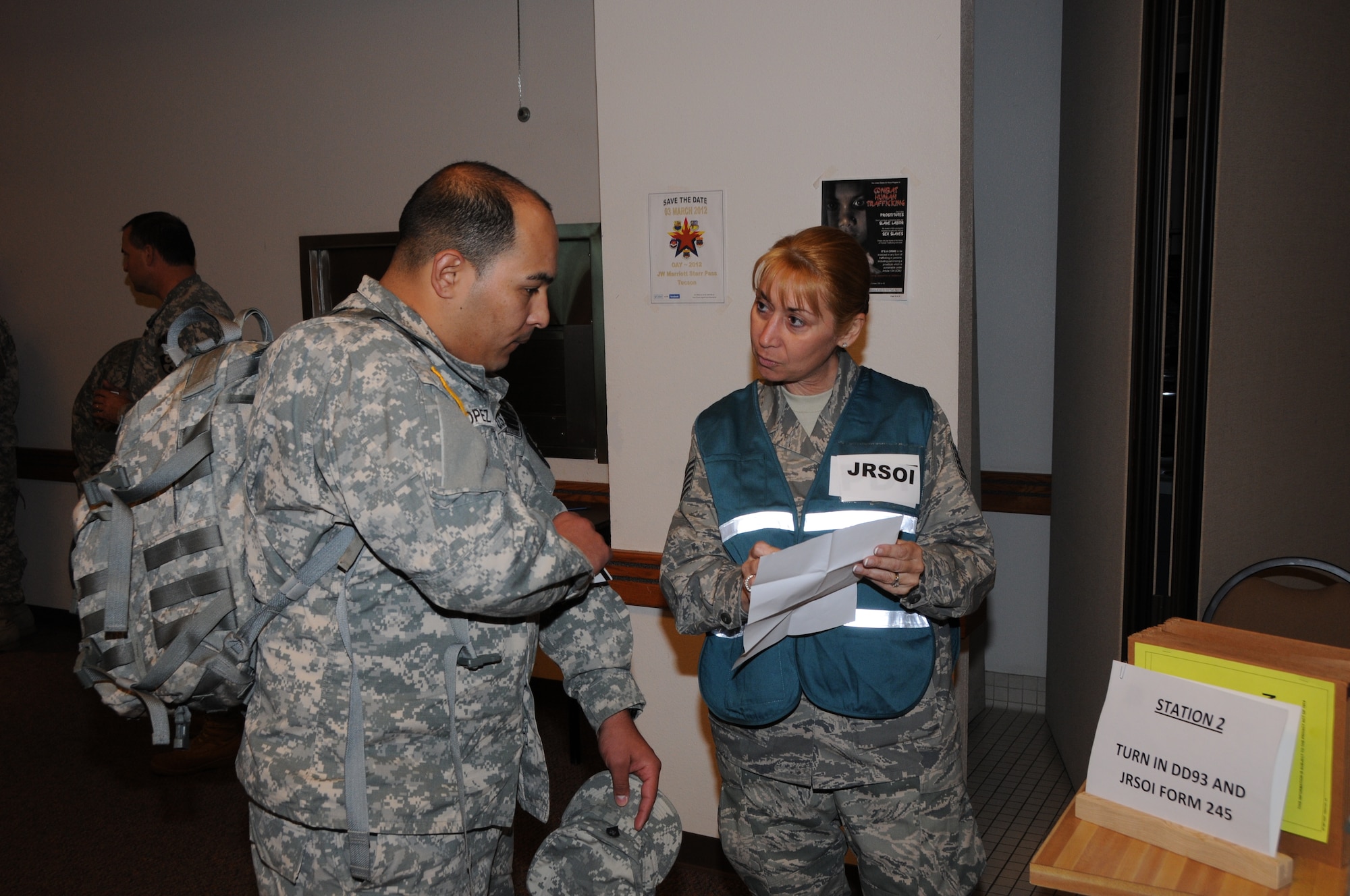 Tech. Sgt. Ariel Goodwin (right), 161 Air Refueling Wing Force Support Squadron, in processes Sgt. Lopez of the Colorado National Guard in support of Vigilant Guard on Nov. 3, 2011 in Phoenix, Vigilant Guard is an exercise involving the nation's first responders, whose mission was to respond to a simulated flood and improvised nuclear device detonation during the exercise here, Nov. 2-7, 2011. Members from the 161 ARW, along with National Guard units from California, Colorado, and Arizona, along with local, state and federal emergency responders participated in the exercise. (U.S. Air Force photo/Master Sergeant Kelly M. Deitloff)
