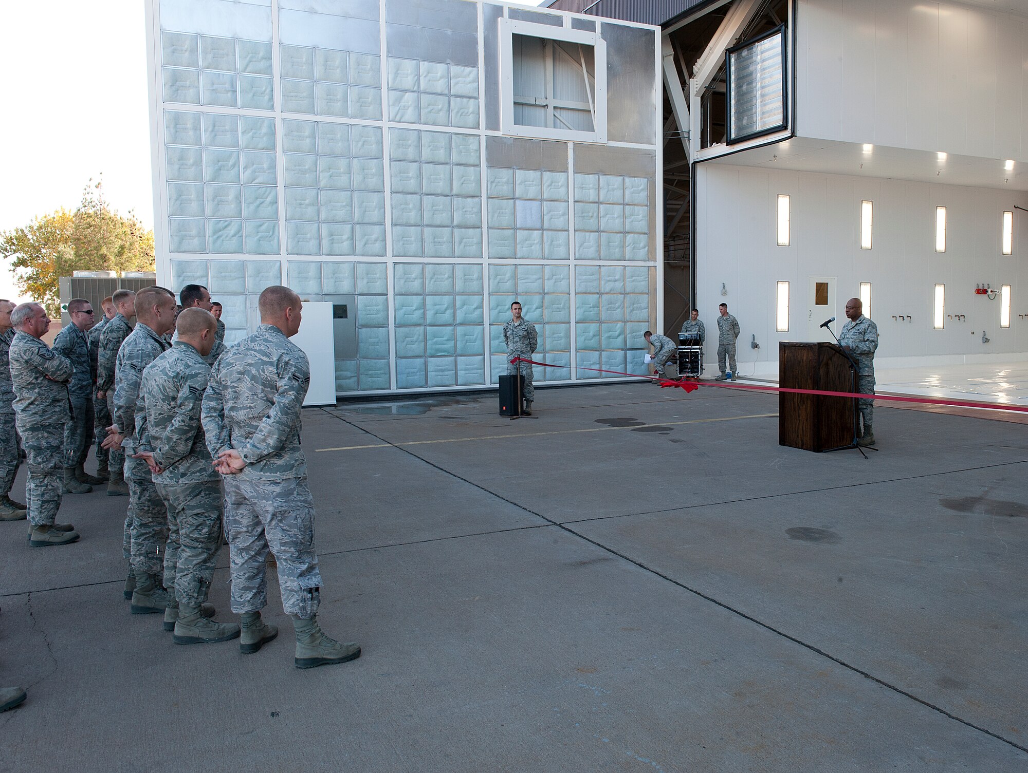 HOLLOMAN AIR FORCE BASE, N.M. -- U.S. Air Force Col. André Kennedy, 49th Maintenance Group commander, speaks to 49th MXG Airmen Nov. 2, 2011, during the dedication and ribbon cutting of the new Low Observatory hangar. The new facility will allow 49th MXG Airmen to repair the LO coating of an aircraft in a more timely manner. (U.S. Air Force photo by Senior Airman DeAndre Curtiss / Released)