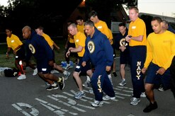 Naval Support Activity personnel begin the mile and half run for the Physical Readiness Test at Joint Base Charleston-Weapons Station Nov. 3.  The PRT, conducted twice a year, consists of a cardiovascular test, push-ups and sit-ups and tests each Sailor’s cardio-respiratory endurance, muscular strength and stamina performance. (U.S. Navy photo/Petty Officer 3rd Classs Brannon Deugan)