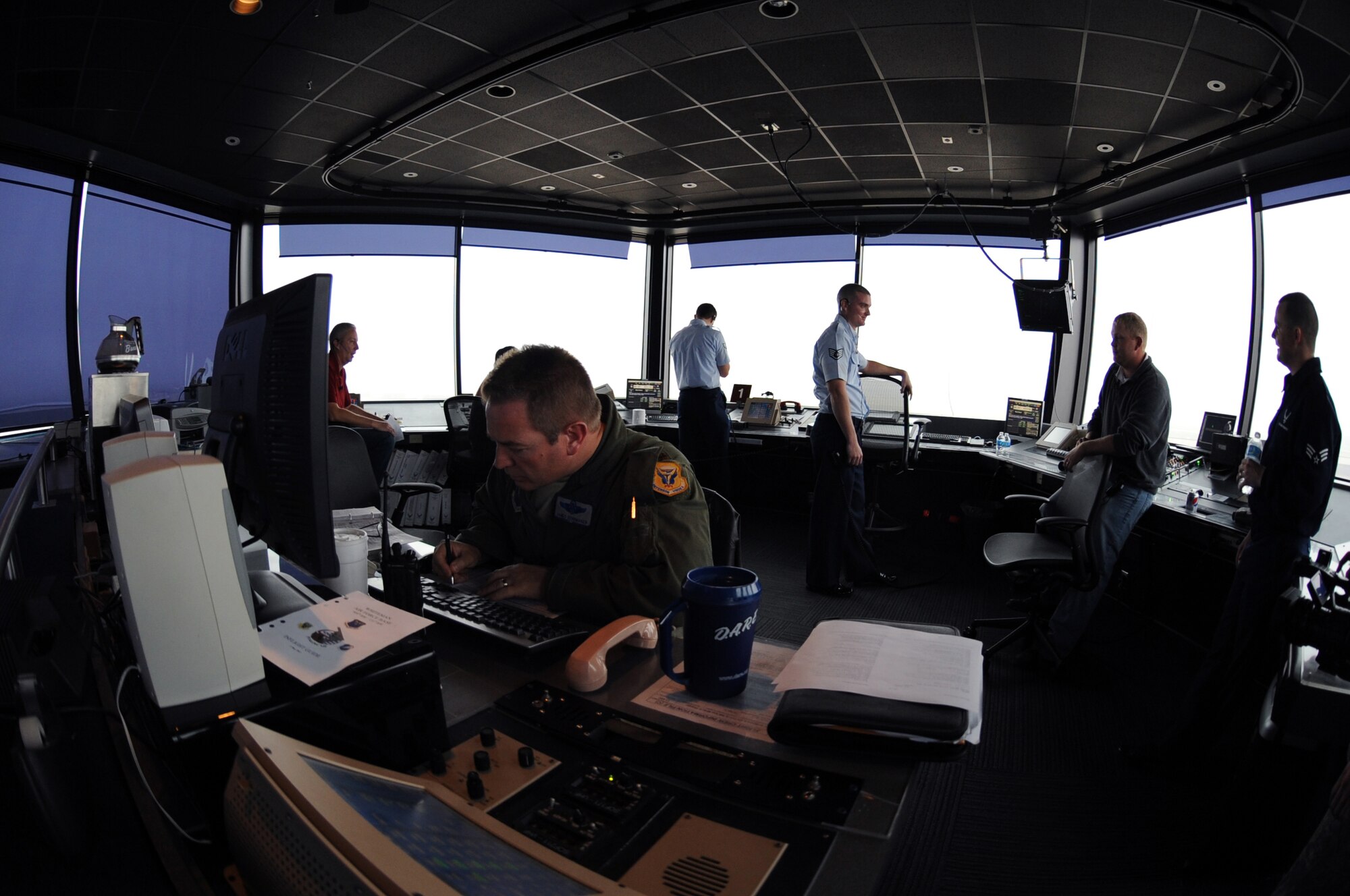 WHITEMAN AIR FORCE BASE, Mo -- Major James Schumaker, 394th Combat Training Squadron flight officer, supervises flying operations Nov. 7. Schumaker performs and manages airfield operations, functions and activities including air traffic control, air field management and base operations. He also manages day-to-day operations of facilities. (U.S. Air Force photo/Senior Airman Laura Goodgame) 