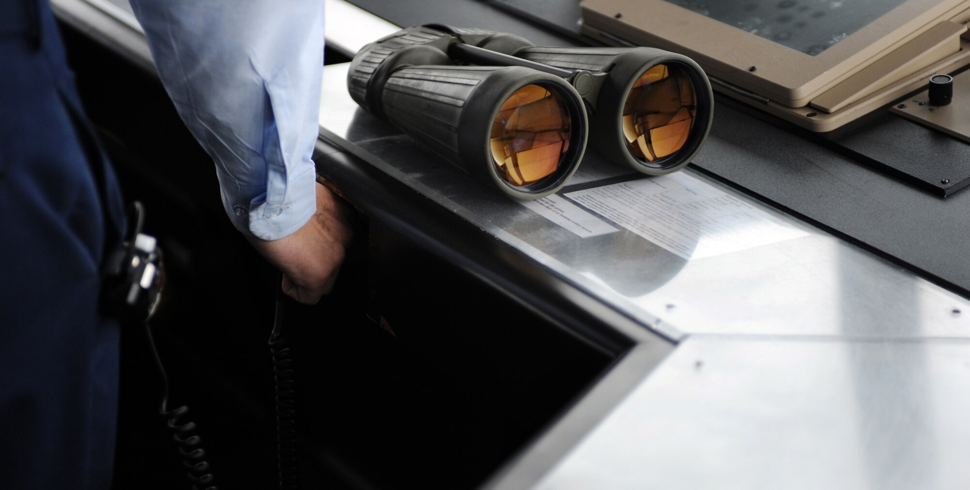 WHITEMAN AIR FORCE BASE, Mo -- Air traffic controllers assigned to the 509th Operations Support Squadron, plug in their headsets at shift change Nov. 7. Together the controllers approve flight clearences, coordinate air traffic control with local airports and maintain safety of flying operations in the air and on the ground. (U.S. Air Force photo/Senior Airman Laura Goodgame) 