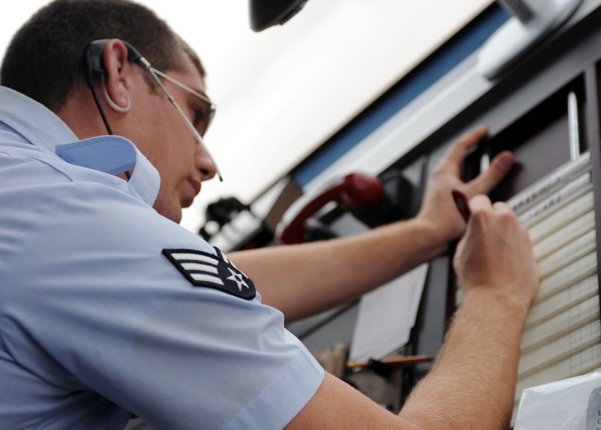WHITEMAN AIR FORCE BASE, Mo -- Senior Airman Craig Gephardt, 509th Operations Support Squadron air traffic controller, keeps track of aircraft landing and launching Nov. 7. Gephardt works with a team of air traffic controllers to approve flight clearances, and maintains safety of flying operations in the air and on the ground. (U.S. Air Force photo/Senior Airman Laura Goodgame) 
