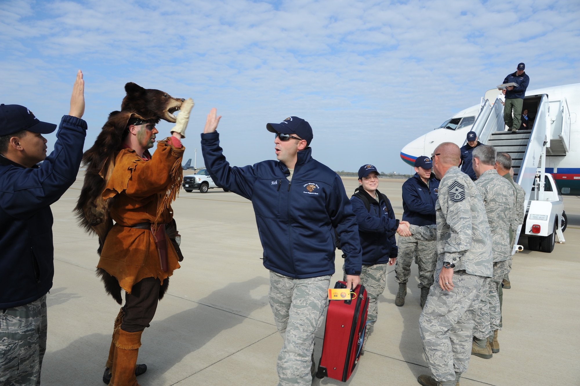 BARKSDALE AIR FORCE BASE, La. -- SSgt Zachary Younger, dressed as the 341st Missile Wing mascot "Roadkill," greets his teammates as they arrive Nov. 6 for the second-annual Global Strike Challenge symposium and scoreposting events this week.  The competition is designed to build a culture of excellence and esprit de corps to motivate bomber, missile and security forces Airmen to new levels of performance and achievement. (U.S. Air Force photo by Master Sgt. Corey A. Clements)