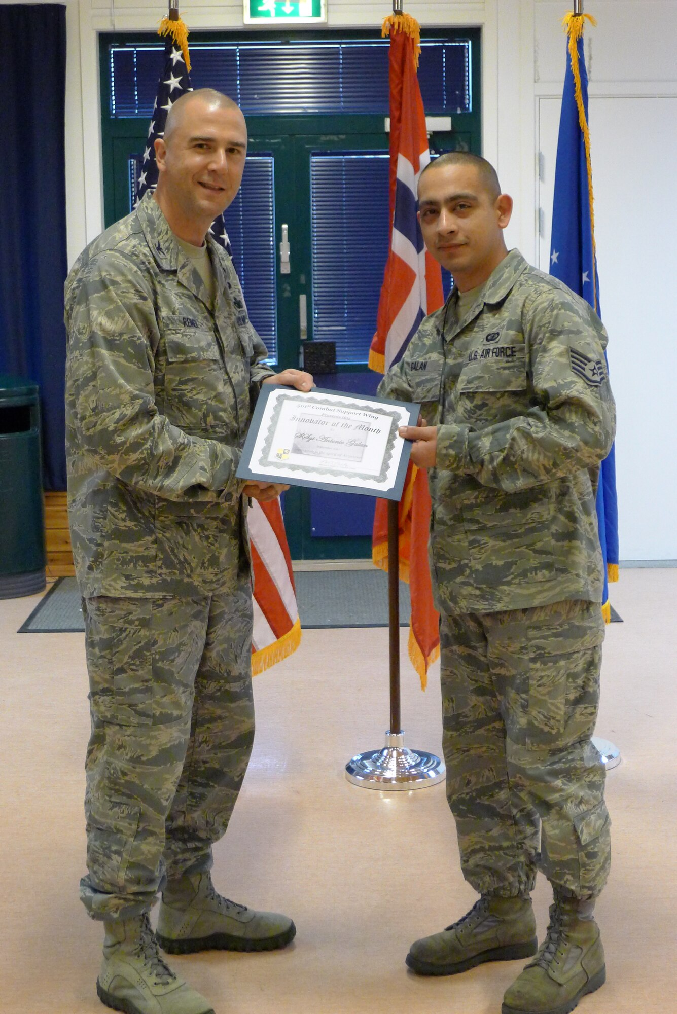 STAVANGER, Norway - Col. Michael Reiner presents the Innovator of the Month award to Staff Sgt. Antonio Galan, 426th Air Base Squadron.Galan identified the need to discontinue the use of the Norwegian Post Box for official mail located in Sola, Norway. (Courtesy photo)