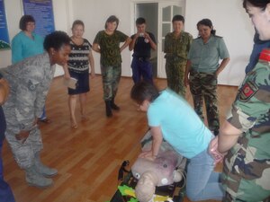 Tech. Sgt. Janice Trader (left) is deployed from the 633rd Medical Operations Squadron to Manas Air Base, Krgyzstan, where she serves as an EMT. Trader has served on active duty for 14 years. (Courtesy photo)