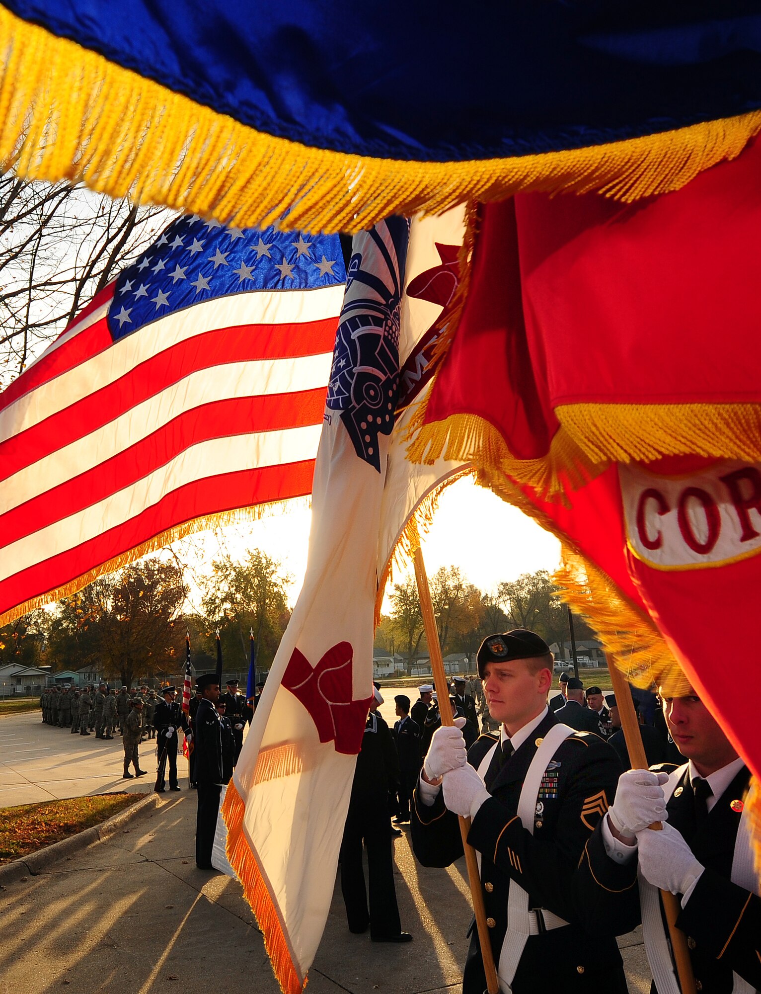 Leading the way, the U.S. Strategic Command's honor guard posts the colors prior to leading members of Team Offutt and tenant units in the 2011 Veterans Day parade held on Mission Ave. in Bellevue, Neb.,  Nov. 5.  Team Offutt members start the annual parade to pay their respects to those who serve in the armed forces. (U.S. Air Force photo by Josh Plueger/Released)