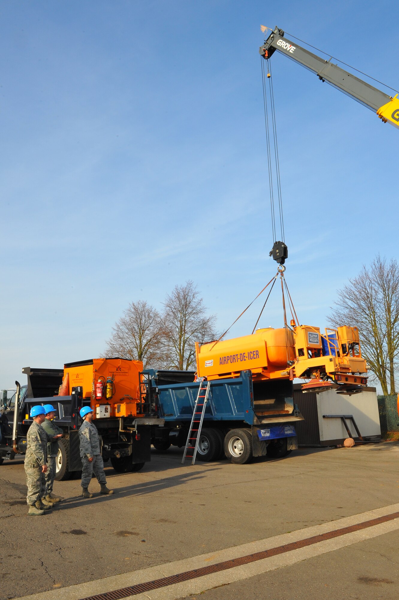 SPANGDAHLEM AIR BASE, Germany – Airmen from the 52nd Civil Engineer Squadron snow-control team learn about the proper safety precautions when moving an airport de-icer tank during annual snow-control augmentee training here Nov. 8. The 52nd CES snow-control team completes annual mandatory training before they can be licensed to operate and maintain snow-removal vehicles used during winter. The team assigns 33 permanent augmentees and 10 alternate augmentees from Nov. 14 to April 15 each year for the snow season. (U.S. Air Force photo/Airman 1st Class Dillon Davis)