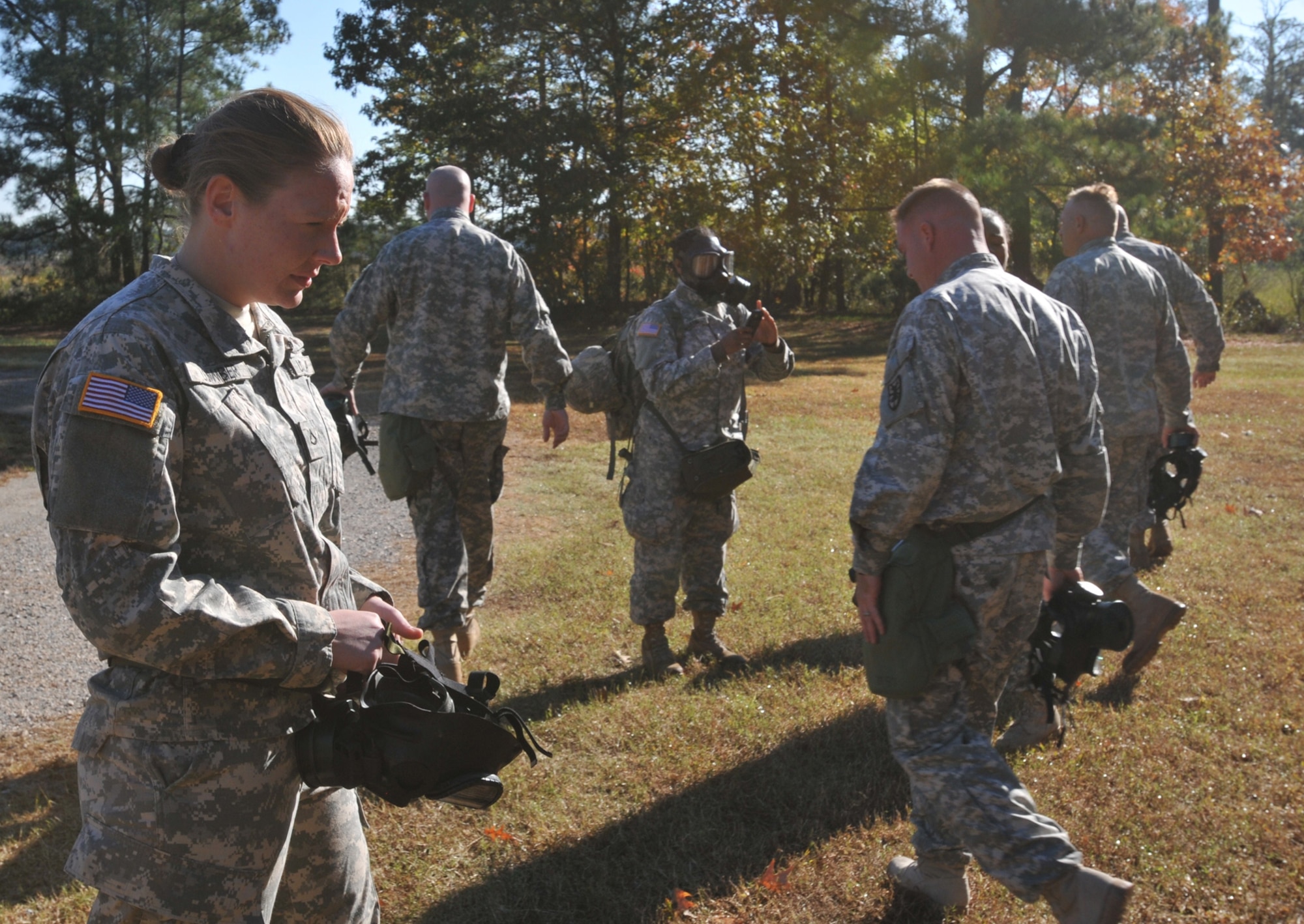 Pfc. Allison Lowber (left), watercraft operator assigned to the 331st Trans. Co., 24th Trans. Bn., 7th Sust. Bde., gets a breath of fresh air after exiting the gas chamber. This is the second trip through the chamber this year for the 27-year old Seattle native, who said, “Our NCOs, and leaders did a great job informing us on what to expect before, during, and after the gas chamber.” (U.S. Army photo by Pfc. Alex Kilmon/RELEASED)